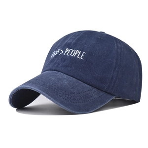 Navy blue washed cotton baseball cap featuring Dogs Over People embroidery and curved brim
