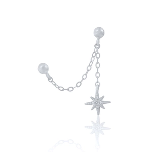 Detail of silver chain earring featuring a North Star pendant with white zircon
