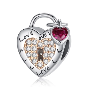 Silver heart bead with rose gold accents, clear crystals and red heart pendant charm