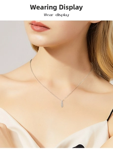 Elegant S925 sterling silver long bar pendant necklace worn by a female model