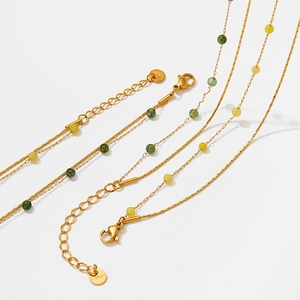 Detail of stainless steel gold chains with natural stone beads and S.steel hallmark