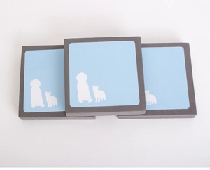 Detail view of square pet hair remover sponge pads with cat and dog silhouettes