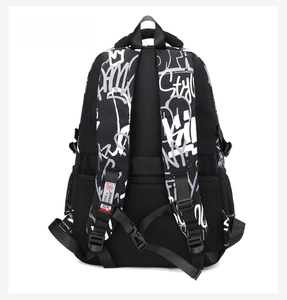 Detail of ergonomic padded shoulder straps and chest buckle on graffiti school backpack