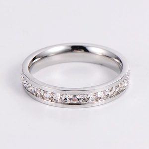 Macro shot of silver ring with full cubic zirconia pave setting and clear square cut crystals
