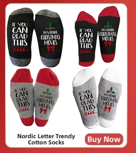 Detail of Christmas cotton socks with festive letter prints and snowman patterns