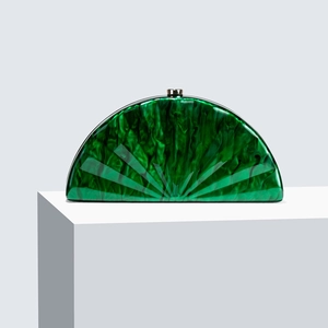 Detailed macro view of a green marble acrylic crescent clutch bag with fan radial grooves
