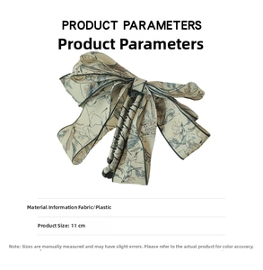 Detail view of 11cm ink-style fabric bow banana clip showing textile texture and dimensions
