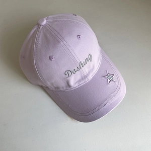 Detail of lavender cotton baseball cap featuring Dashing embroidery and star patch