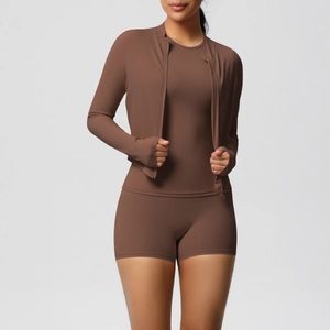 Three-piece brown yoga set featuring high-waisted shorts and a long-sleeve zip-up jacket