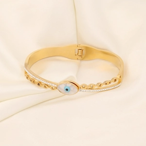Modischer Gold-Edelstahl-Armreif mit bösem Blick Design und Pavé-Kristallen