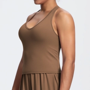 Detail view of brown racerback tank top and matching shorts in matte high-stretch fabric
