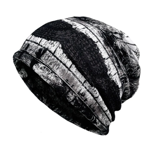 Detail of breathable slouchy beanie featuring black and white abstract artistic print