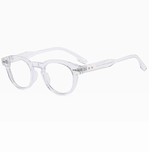 Detailed macro view of clear round glasses frame with gold star rivets on the hinges