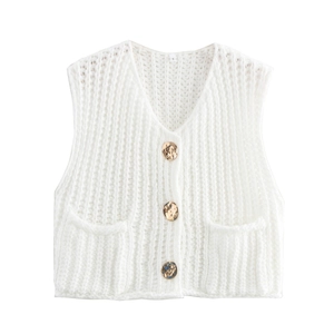 Close-up of white chunky knit vest with vintage gold buttons and front pockets details