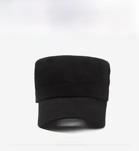 Front view of a black cotton flat top military cap with short curved brim and solid structure