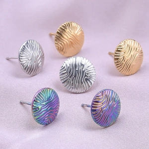 Macro shot of 304 stainless steel hoop earrings in gold, silver, and rainbow finishes