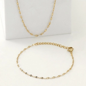 18K gold plated stainless steel lip chain necklace and bracelet jewelry set on white stand