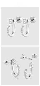 Close-up of silver U-shaped zirconia earrings with secure screw-back closure detail