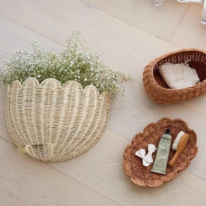 Detail of three handmade rattan wall hanging baskets for home storage and decor