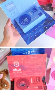 Detail of 3D pop-up greeting cards in record player style with ocean and sunset themes