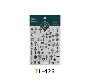 Macro detail of TL-426 gothic 3D nail stickers with cross and heart embossed patterns