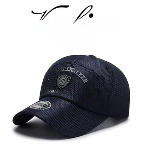 Detail of breathable mesh fabric and white embroidered logo on navy baseball cap