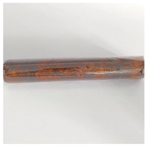 Detailed view of Halloween brown mesh roll with bat and spider web patterns in packaging