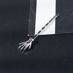 Unique silver metal skeleton hand hairpin with wave design on textured background