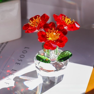 Macro detail of red crystal flowers with golden stamens and clear faceted base