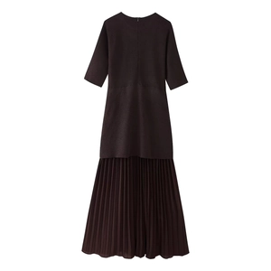 Detail of short sleeve dress featuring knitted bodice and pleated chiffon hemline