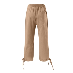 Detail of cotton linen wide-leg pants with elastic waist and drawstring bow on the hem