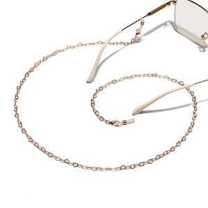 Golden heart-shaped metal link glasses chain shown in a spiral arrangement