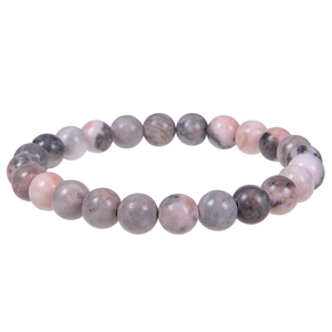 Detailed view of polished natural rhodonite stone beads on minimalist elastic bracelet