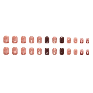 Faux ongles rouge citrouille translucides avec marbrure et détails en feuille d'or