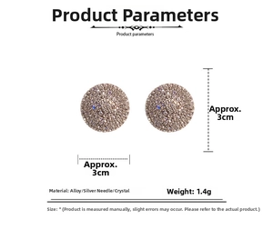 Macro detail of silver needle round stud earrings with shimmering rhinestones inlay