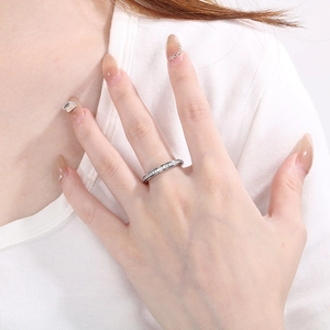 Detail shot of a silver sparkling eternity ring on finger for an elegant and minimalist look