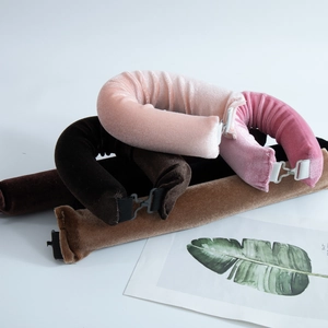 Detailed close-up of three 3cm thick velvet heatless hair curlers in pink and brown tones