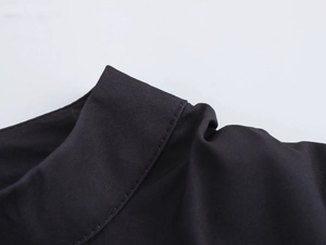 Macro shot of precise stitching and high-quality woven fabric on retro lantern sleeve blouse