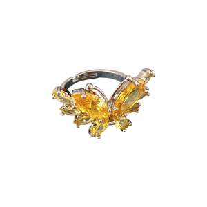 Elegant silver adjustable butterfly ring with yellow zircon stones on white background