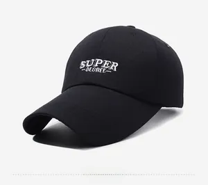 Detail of white SUPER DEGREE embroidery on a premium black canvas baseball cap