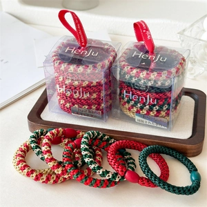 8-piece set of Christmas elastic hair ties in festive red and green colors with gift box