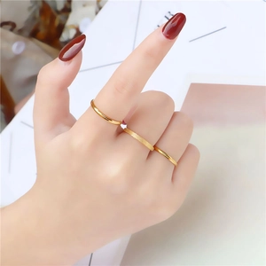 Three-piece stackable gold titanium steel rings featuring smooth and frosted slim bands