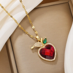 Luxurious titanium apple pendant necklace with red heart-shaped crystal and gold chain