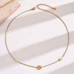 Minimalist gold titanium steel necklace featuring three delicate hollow leaf pendants