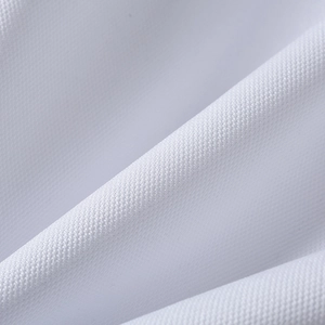 Macro shot of premium white high-density fabric texture for golf polo shirts