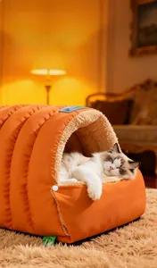 Detail of warm orange quilted cat bed with soft beige velvet fleece lining for winter comfort