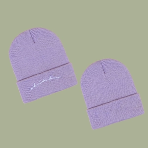 Lavender knitted beanie featuring white bear embroidery and ribbed cuff for autumn warmth