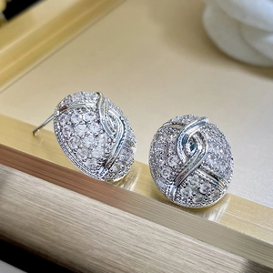 Vintage oval silver studs with sparkling cubic zirconia in a crisscross pattern