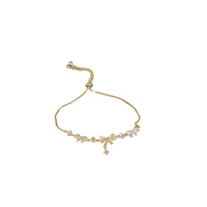 Gold plated bracelet with zircon flower and bow design, elegant adjustable jewelry for women