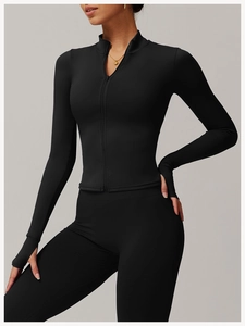 Detail of female sports jacket sleeve featuring functional thumbholes and sleek slim fit